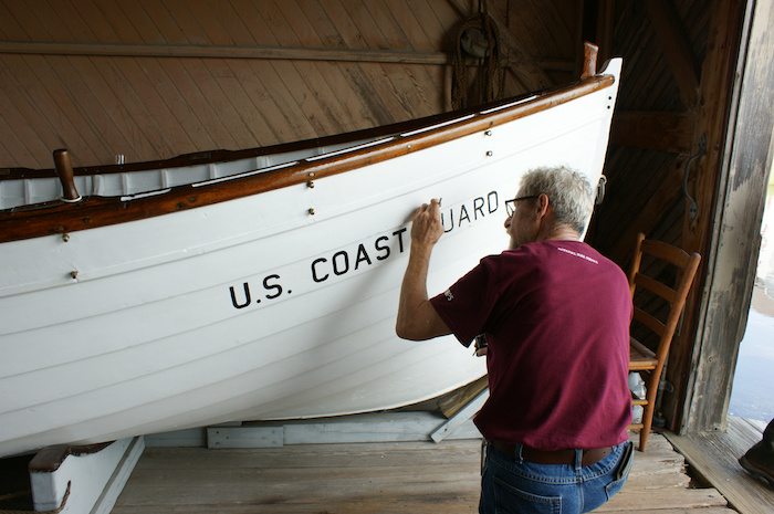 arpers Ferry Center volunteer lab assistant, Mick Feeser, restoring Surfboat 1046/NPS,Patricia Owens  