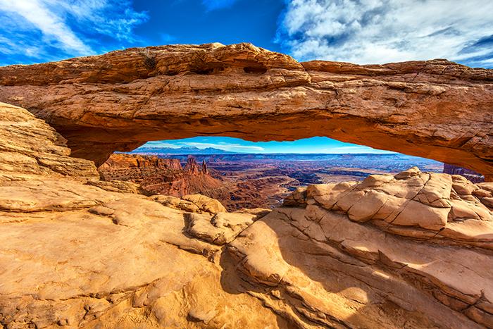 A midday view of Mesa Arch and the vista beyond, Canyonlands National Park / Rebecca Latson