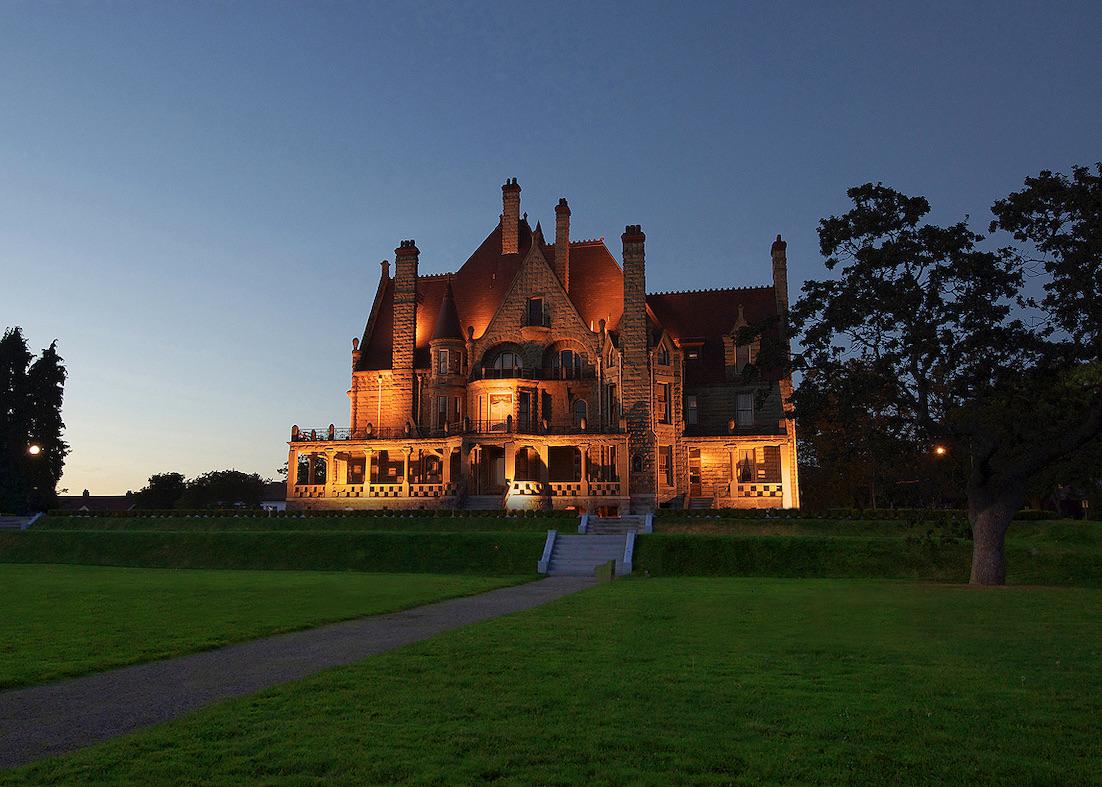 Craigdarroch Castle, with views of Victoria, is lit up at night.