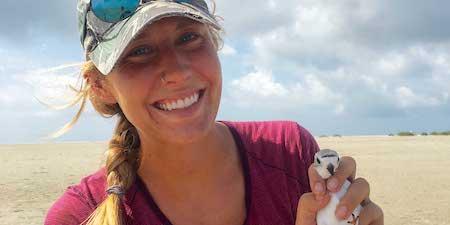 Chelsea Weitham in the field working with piping plovers/HO
