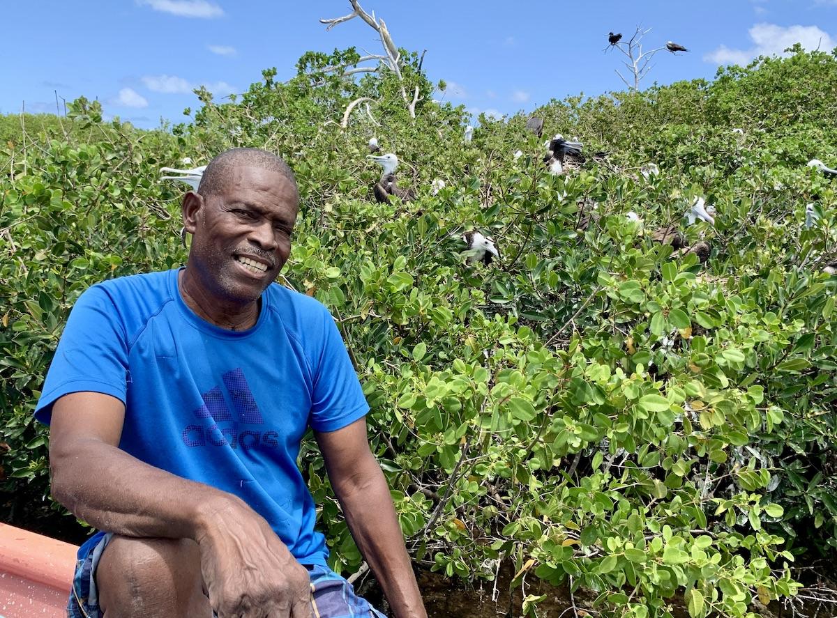 Clarence Nibbs guides visitors to the frigatebird sanctuary in Barbuda.