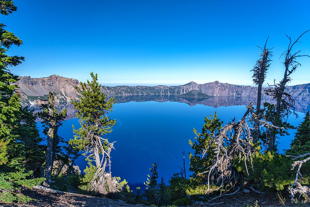 Blue water, blue sky, and natural frames, Crater Lake National Park / Rebecca Latson