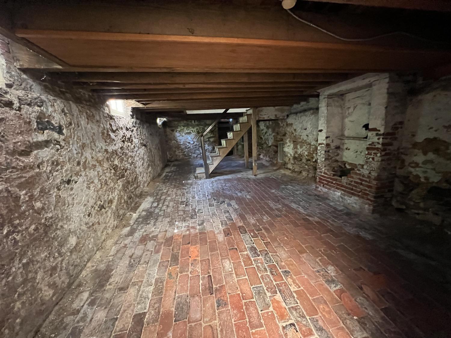 The cellar at Edgar Allan Poe's former house is empty except for cobwebs.