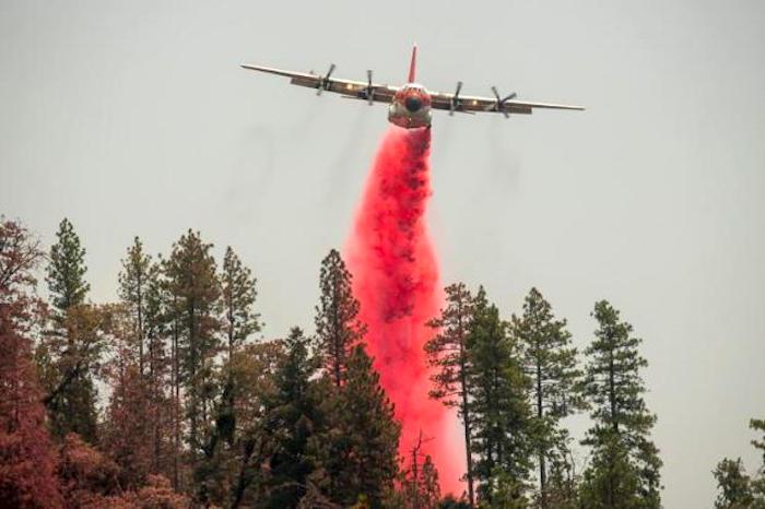 A C-130 air tanker drops chemical retardant on the Ferguson Fire in California/USFS 7-23-18