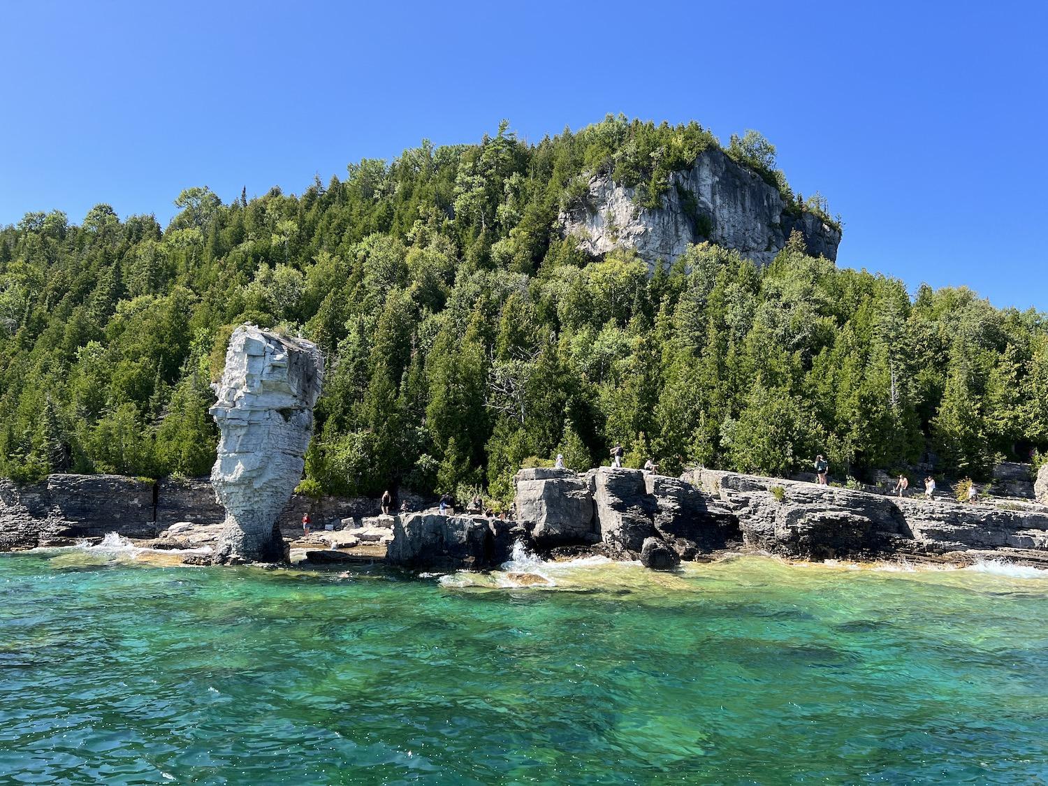 People congregate around the "large flowerpot" on Flowerpot Island in Fathom Five National Marine Park in Ontario.