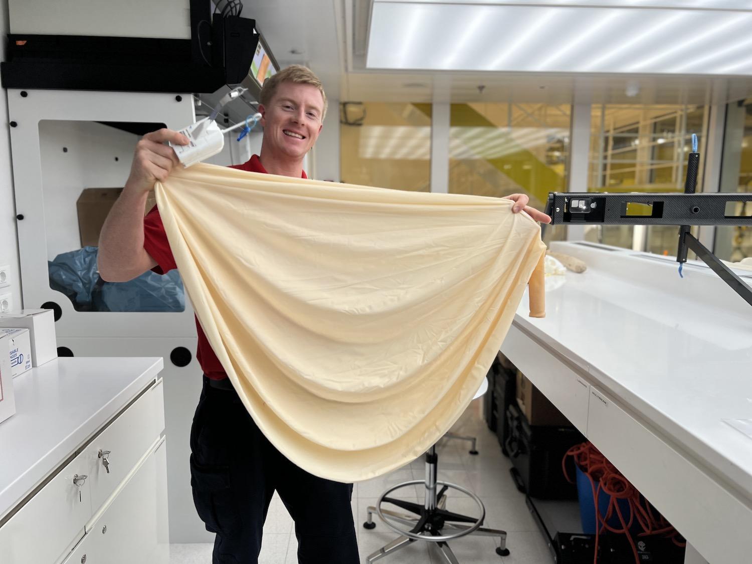 In the lab of the Viking Octantis, field scientist Josh Pons shows off a weather balloon.