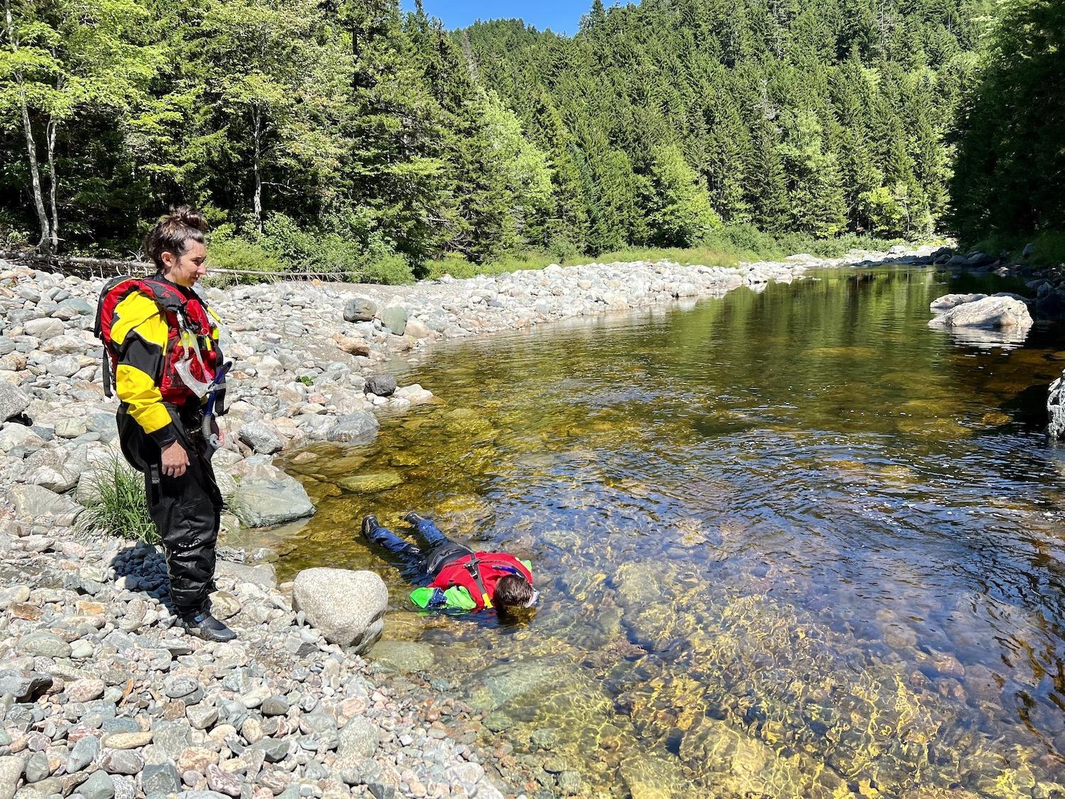 Danielle Latendresse stays on shore as John Robinson quietly searches for salmon.
