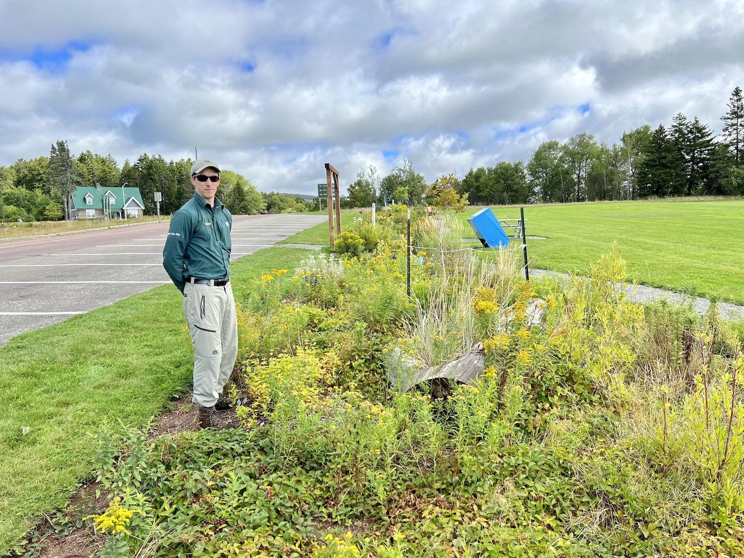 Resource management officer Neil Vinson shows off the pollinator garden at Fundy National Park.