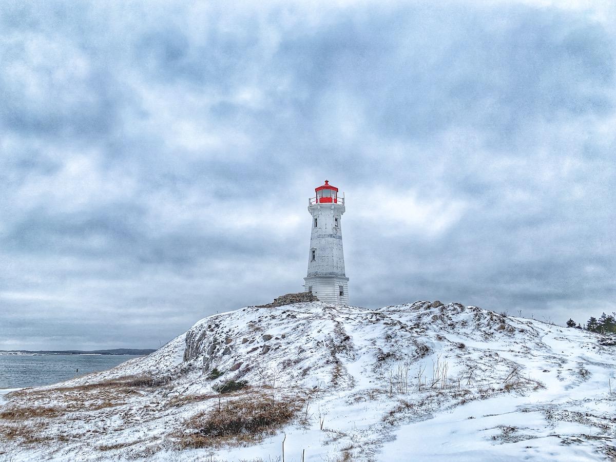An aging lighthouse stands near the spot where the French built Canada's first lighthouse. It's a short drive from the fortress and not on the Ruins Walk.