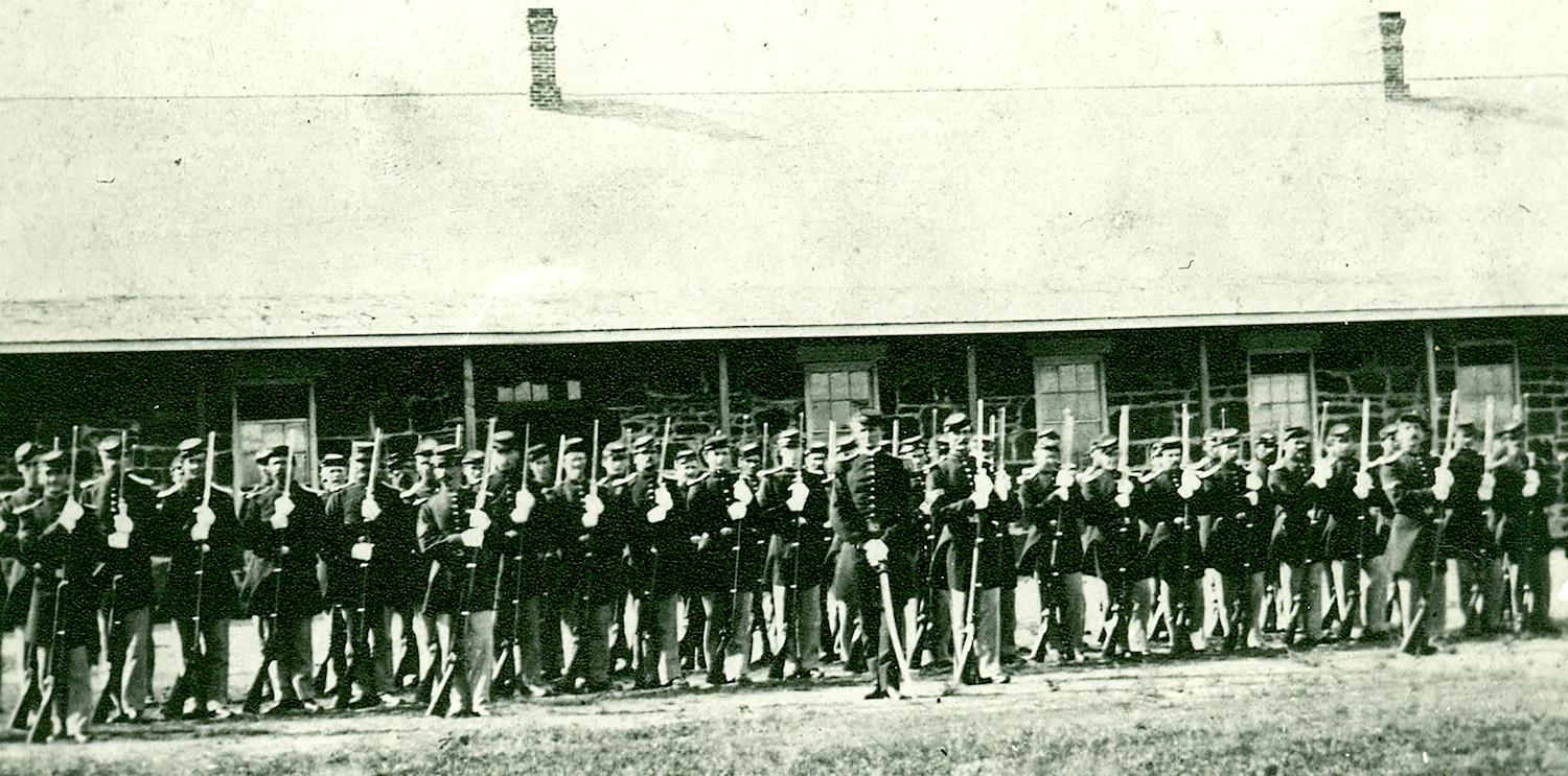 Company C of the Third Infantry, pictured here in 1867 in front of their barracks, was implicated in the burning down of the 10th Cavalry's stables/NPS archives