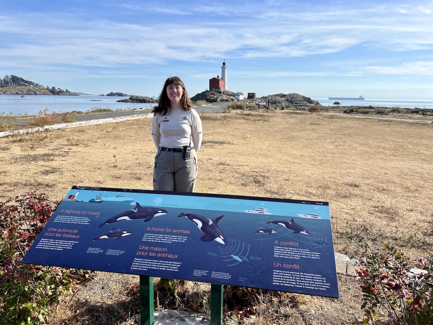 Heritage presenter Anna Lee stands by new signage that show that Fort Rodd Hill is part of the Whale Trail and a place to watch for sea mammals from shore.