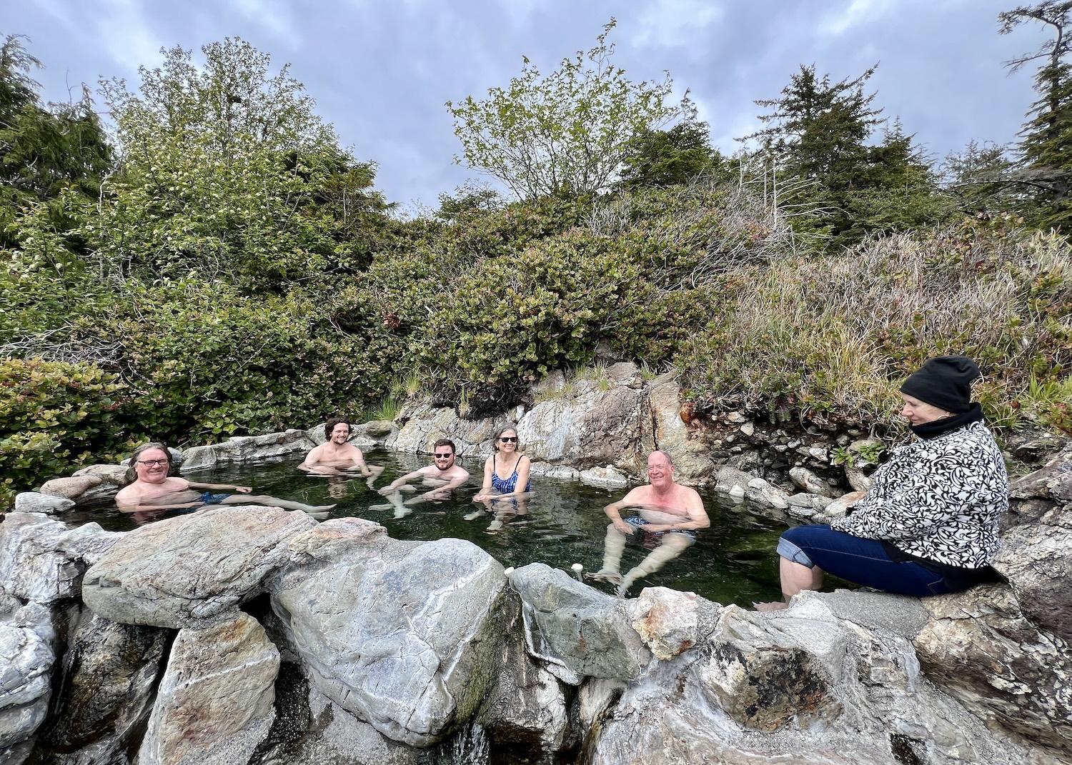 While exploring Gwaii Haanas with Haida Style Expeditions, guests soak in hot springs at Hotspring Island.