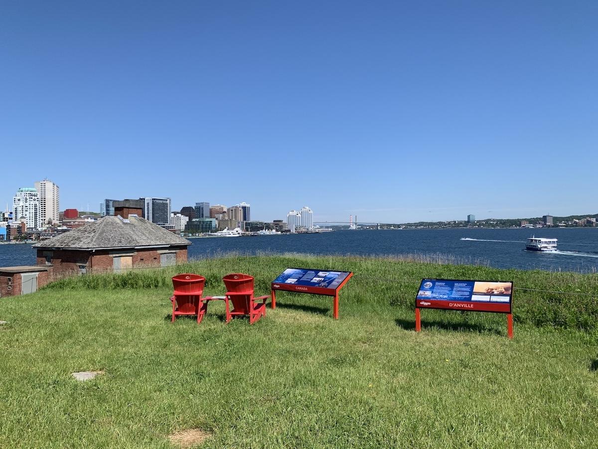 Enjoying a Parks Canada picnic on Georges Island with the Halifax skyline and Kawartha Spirit ferry in the background.