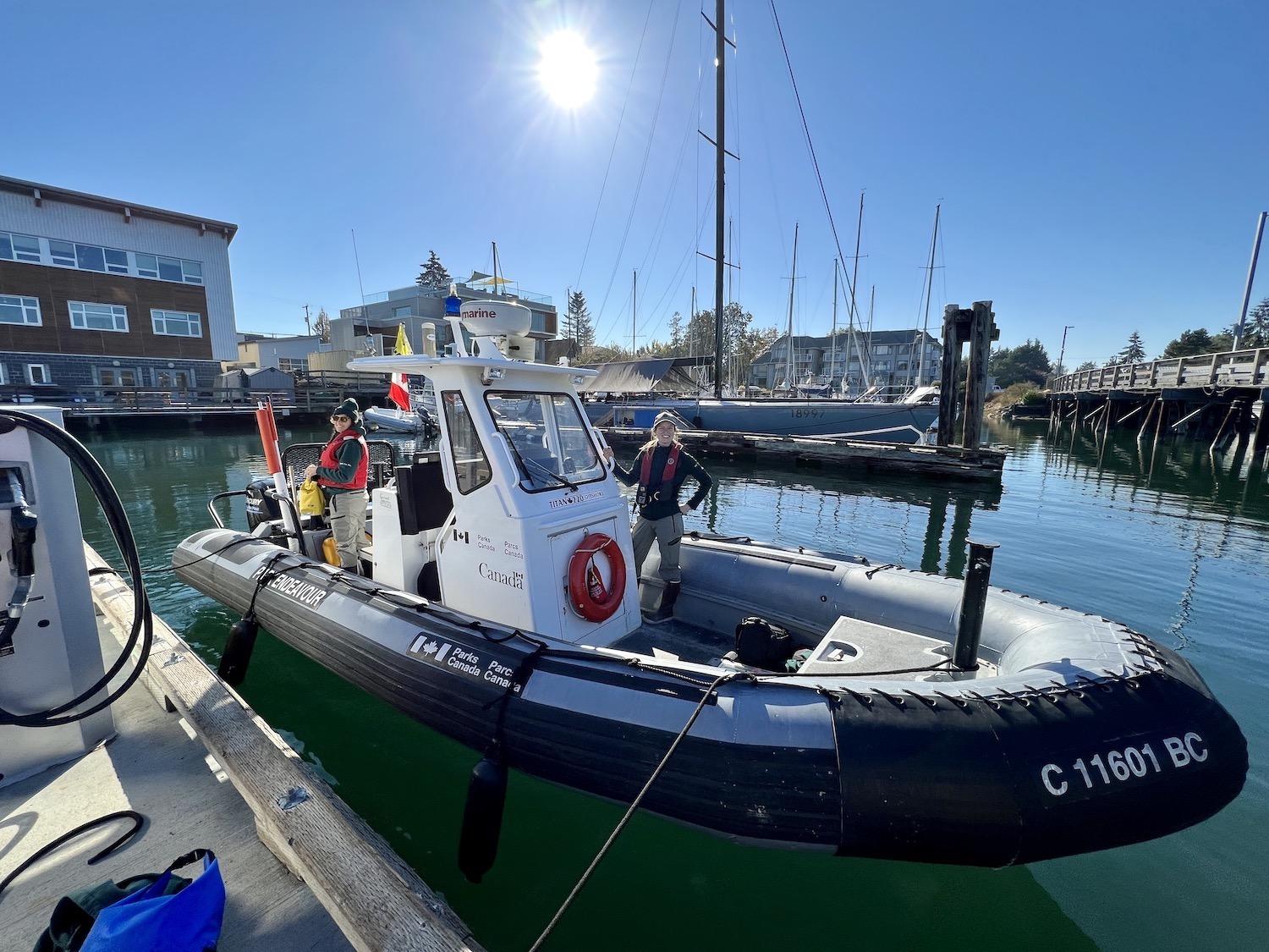 Molly Clarkson and Kirsten Mathison show one of the Parks Canada boats that's used in Gulf Islands National Park Reserve.