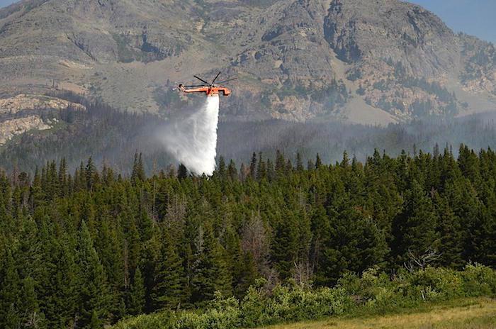 Helicopter dumps water on Reynolds Creek Fire in Glacier National Park/NPS
