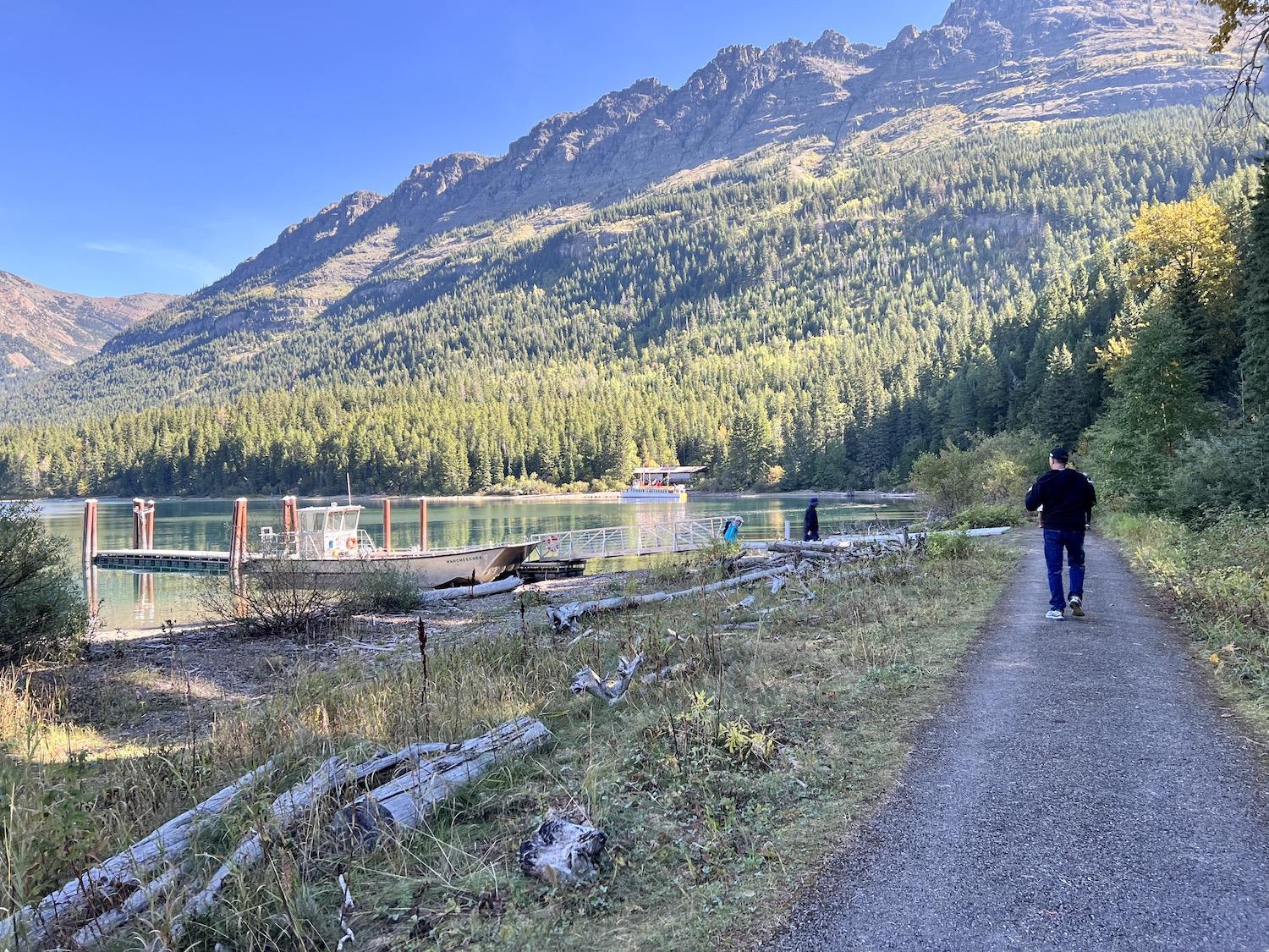 A paved pathway goes between the Goat Haunt boat landing and the ranger station.