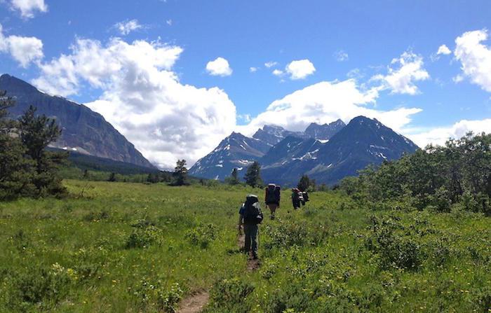 Hikers on Pacific Northwest Scenic Trail in Glacier National Park