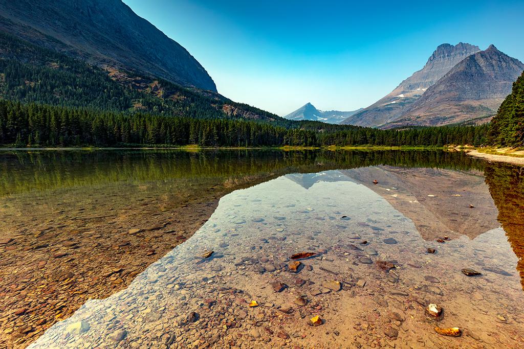 Fishercap Lake reflections, Glacier National Park / Rebecca Latson