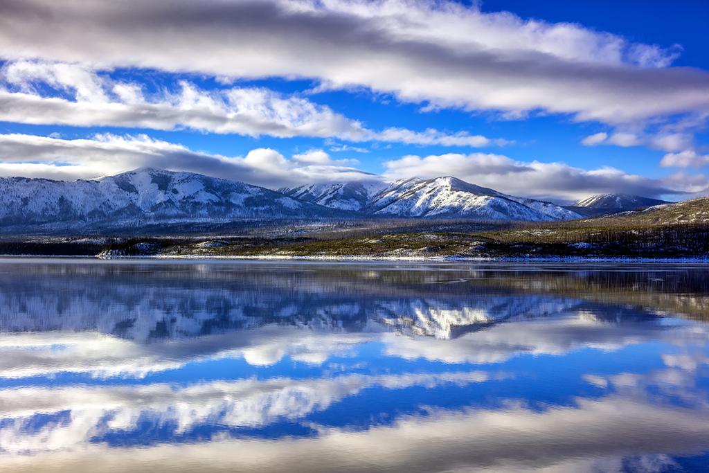 Lake McDonald afternoon reflections, Glacier National Park / Rebecca Latson