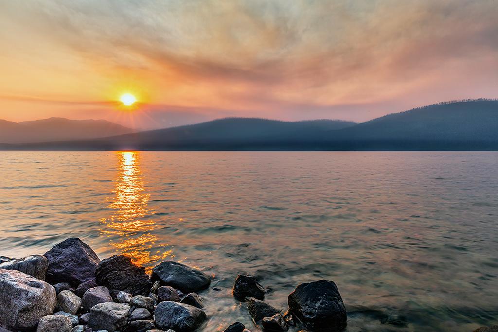 A smoky sunset over Lake McDonald, Glacier National Park / Rebecca Latson