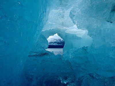 Looking out at Glacier Bay through an ice cave. Credit: NPS
