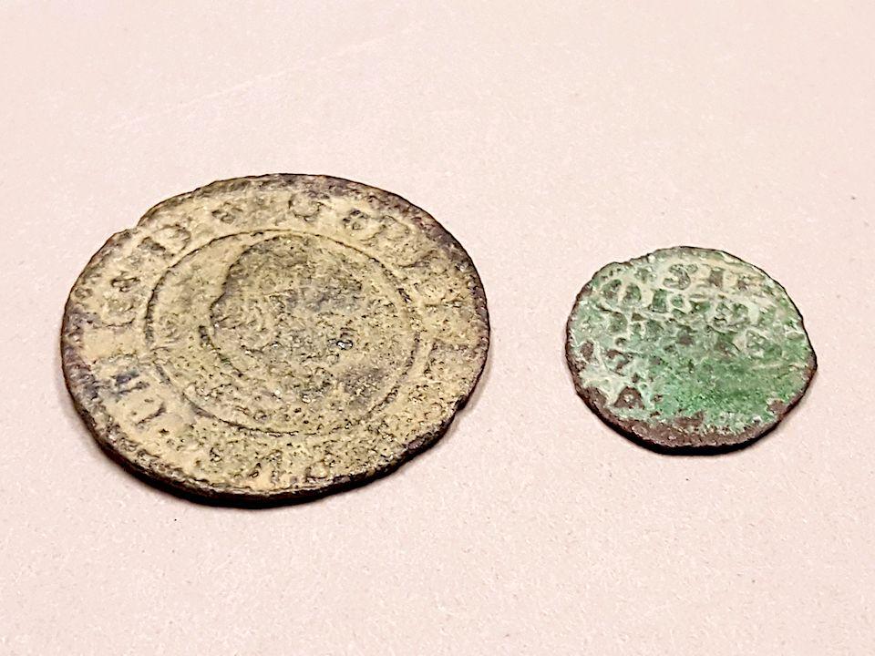 How did these two coins, believed to be Spanish pieces dating to the 13th century, get to Glen Canyon NRA?/NPS