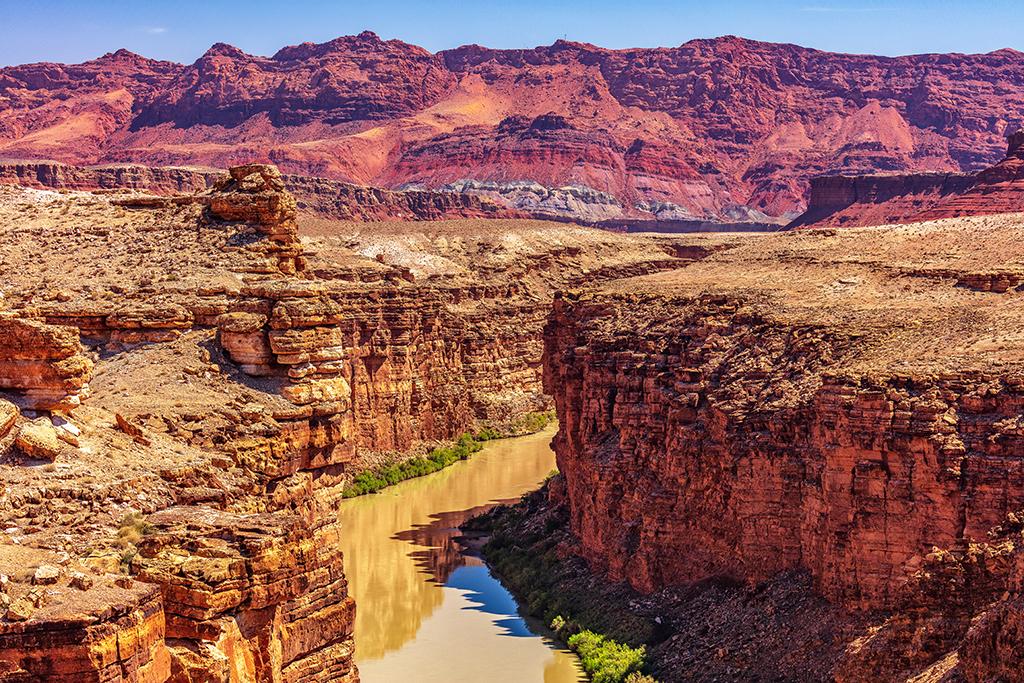 A telephoto landscape of the Colorado River and Vermilion Cliffs, Glen Canyon National Recreation Area / Rebecca Latson