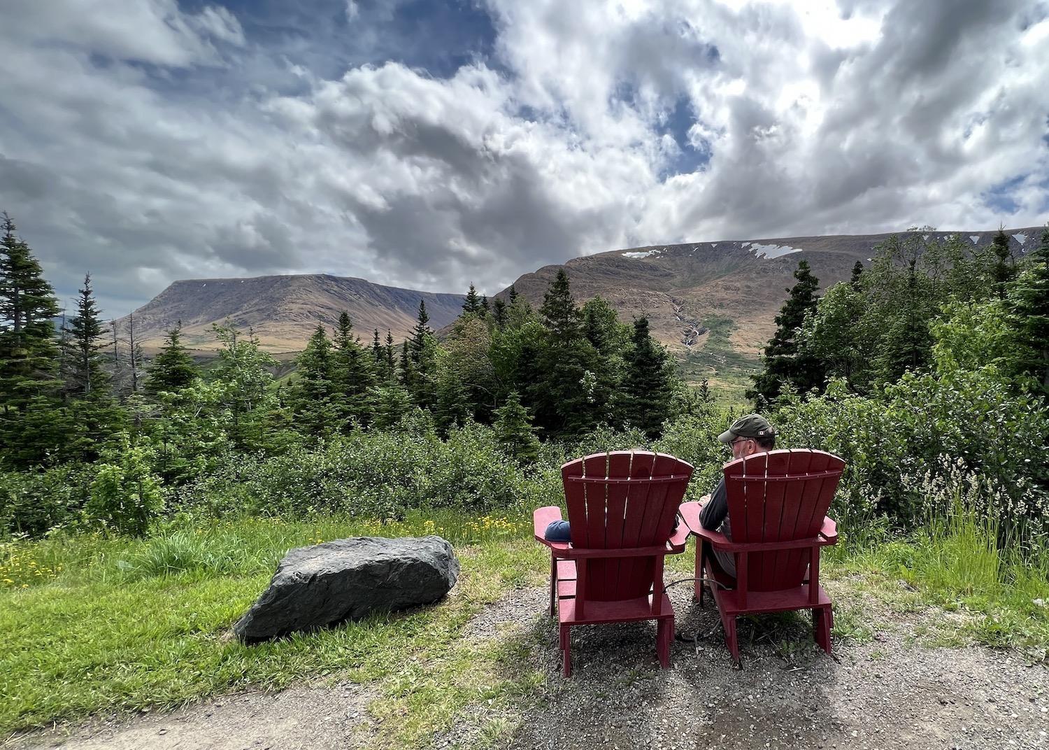 A pullout along Route 431 (Bonne Bay Road) has two Parks Canada red chairs and views of the Tablelands.