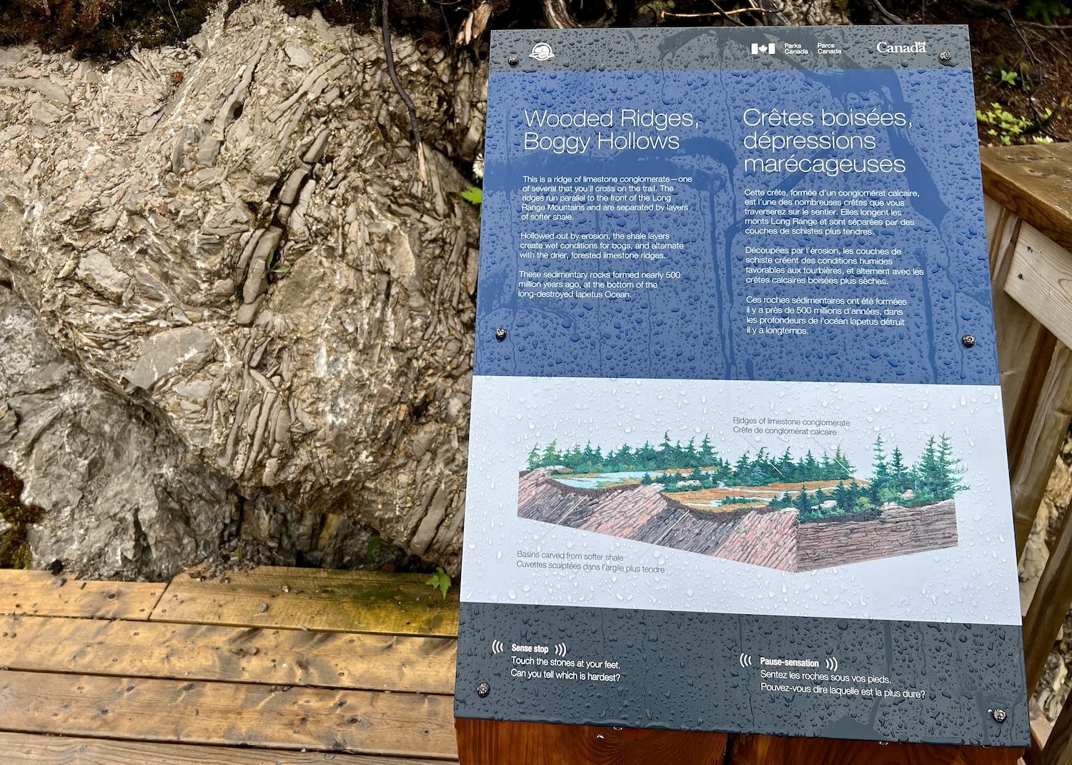 An interpretive sign explains why a ridge of limestone conglomerate is important.