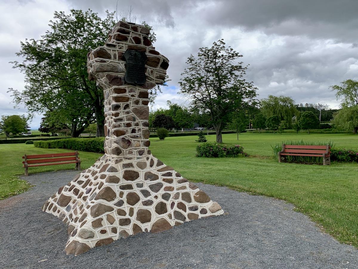 This stone cross is named for John Frederic Herbin who preserved this land as a memorial to Acadians.