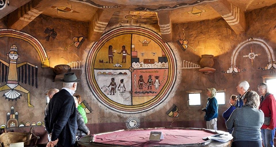 Viewing murals painted by Hopi Artist Fred Kabotie inside Desert View Watchtower. NPS/Sandy Graham