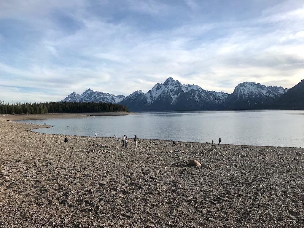 The wide stretch of exposed beach at Swim Beach didn't stop park visitors from enjoying the evening setting on the shore of Jackson Lake/Kurt Repanshek