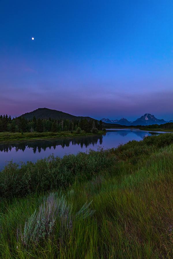 The moon and blue hour at Oxbow Bend, Grand Teton National Park / Rebecca Latson