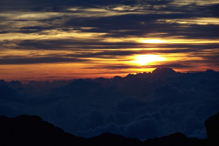 Sunrise from the crater at Haleakala National Park in Hawaii