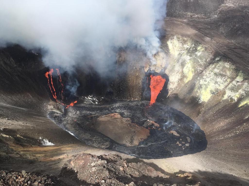 Aerial view of the Kīlauea summit eruption from a Hawaiian Volcano Observatory overflight at approximately 11:20 a.m. HST. The two active fissure locations continue to feed lava into the growing lava lake in Halema‘uma‘u crater.