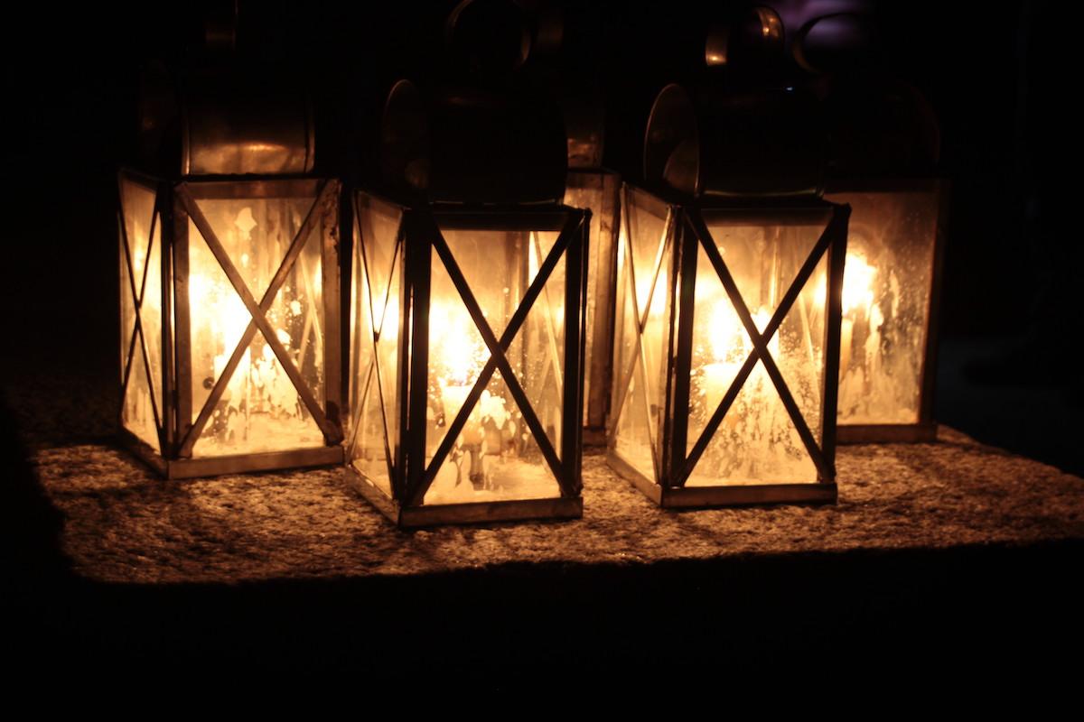 Candle-lit lanterns set the mood on a ghost tour.