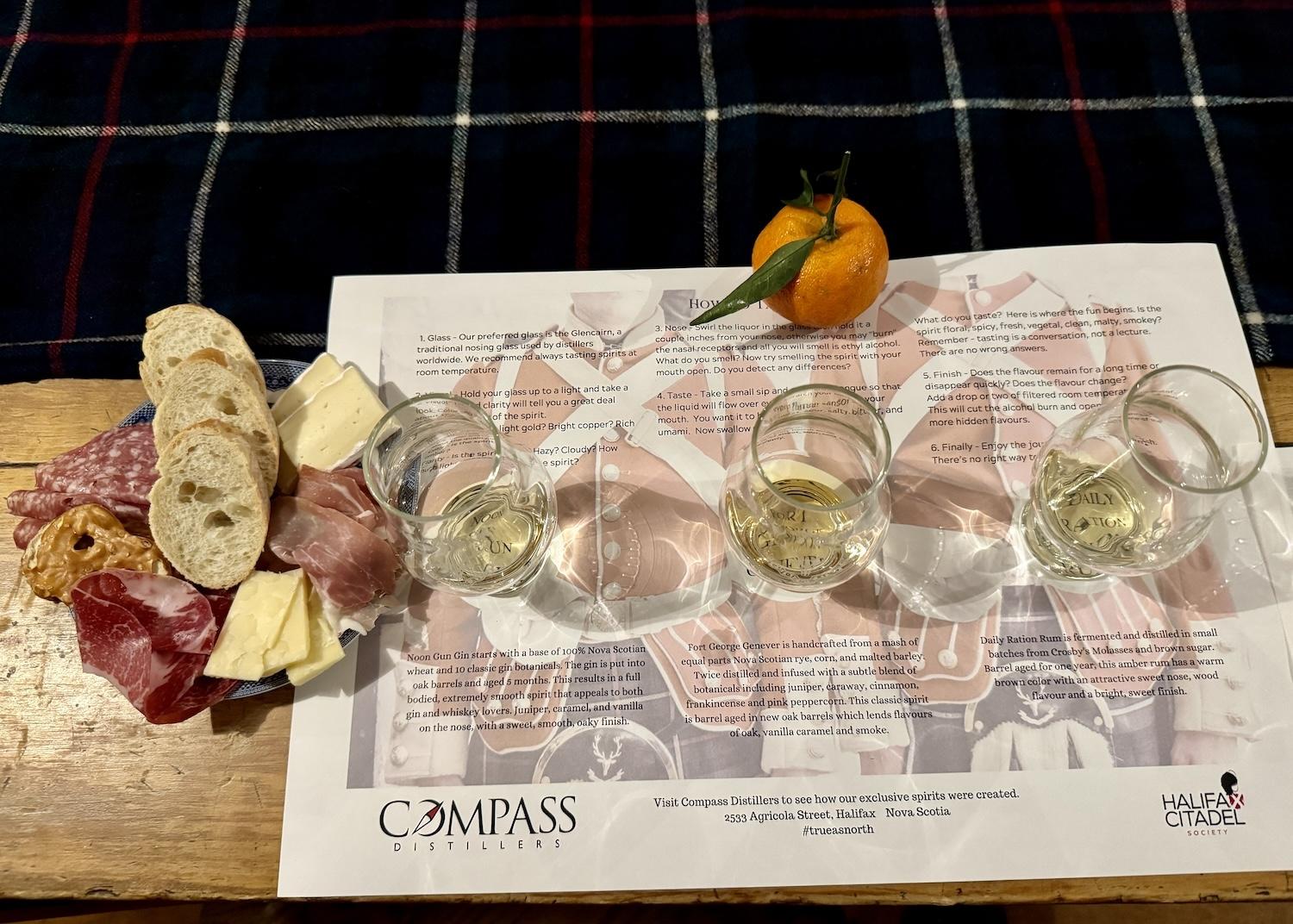 A spirits tasting comes with local charcuterie and a festive orange. A spirits tasting comes with local charcuterie and a festive orange.