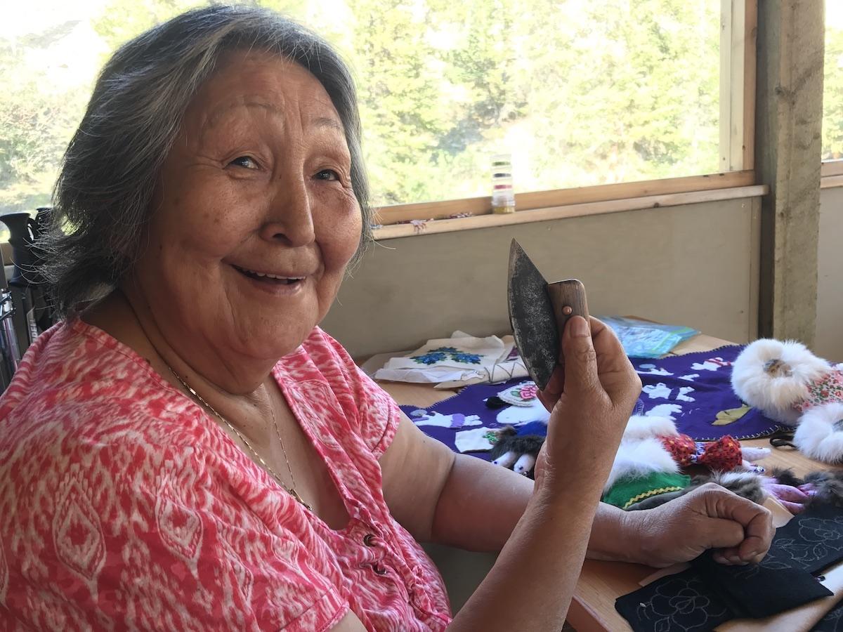 Inuvialuit cultural host Renie Arey shows off her ulu (a traditional knife).