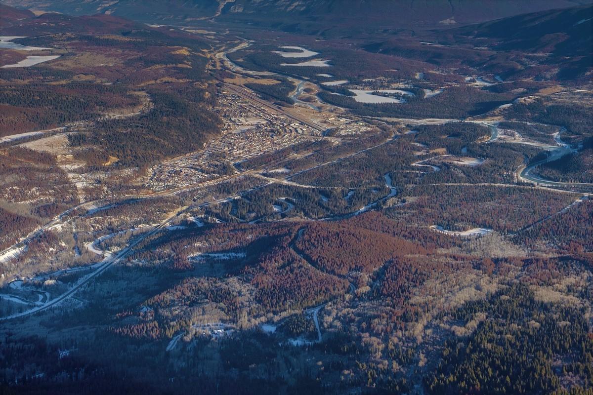 An aerial view of the town of Jasper and surrounding forest.