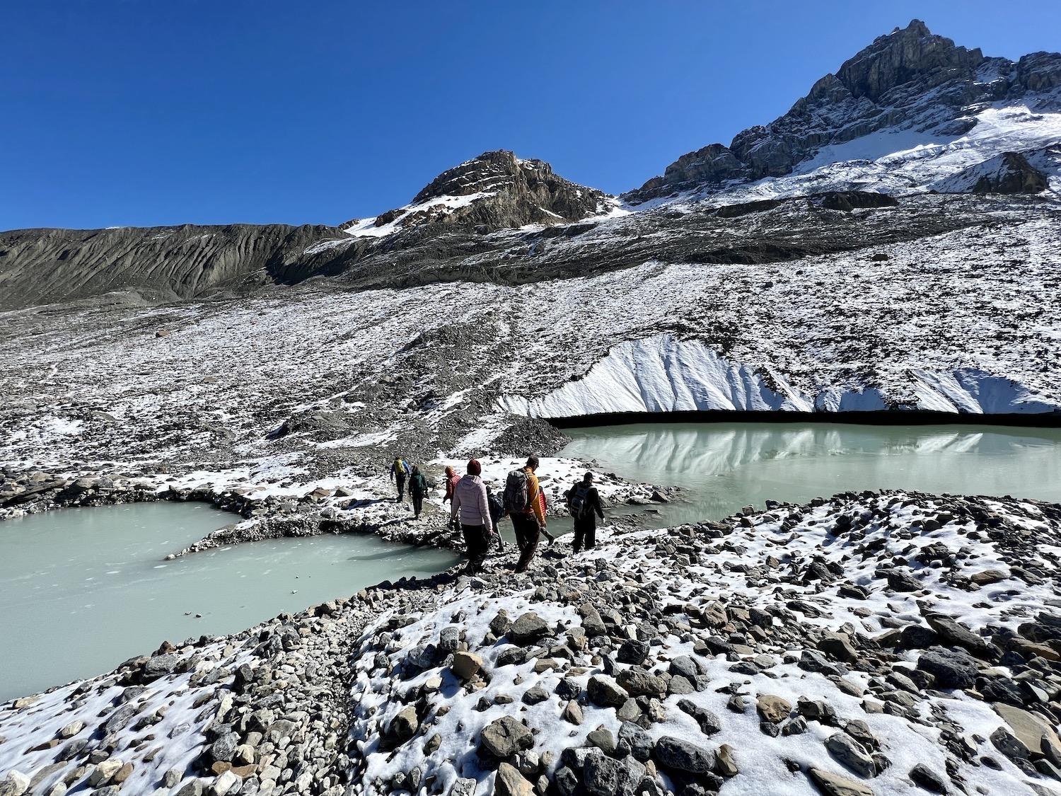 We scramble over a rocky landscape to get on and off the Athabasca Glacier.