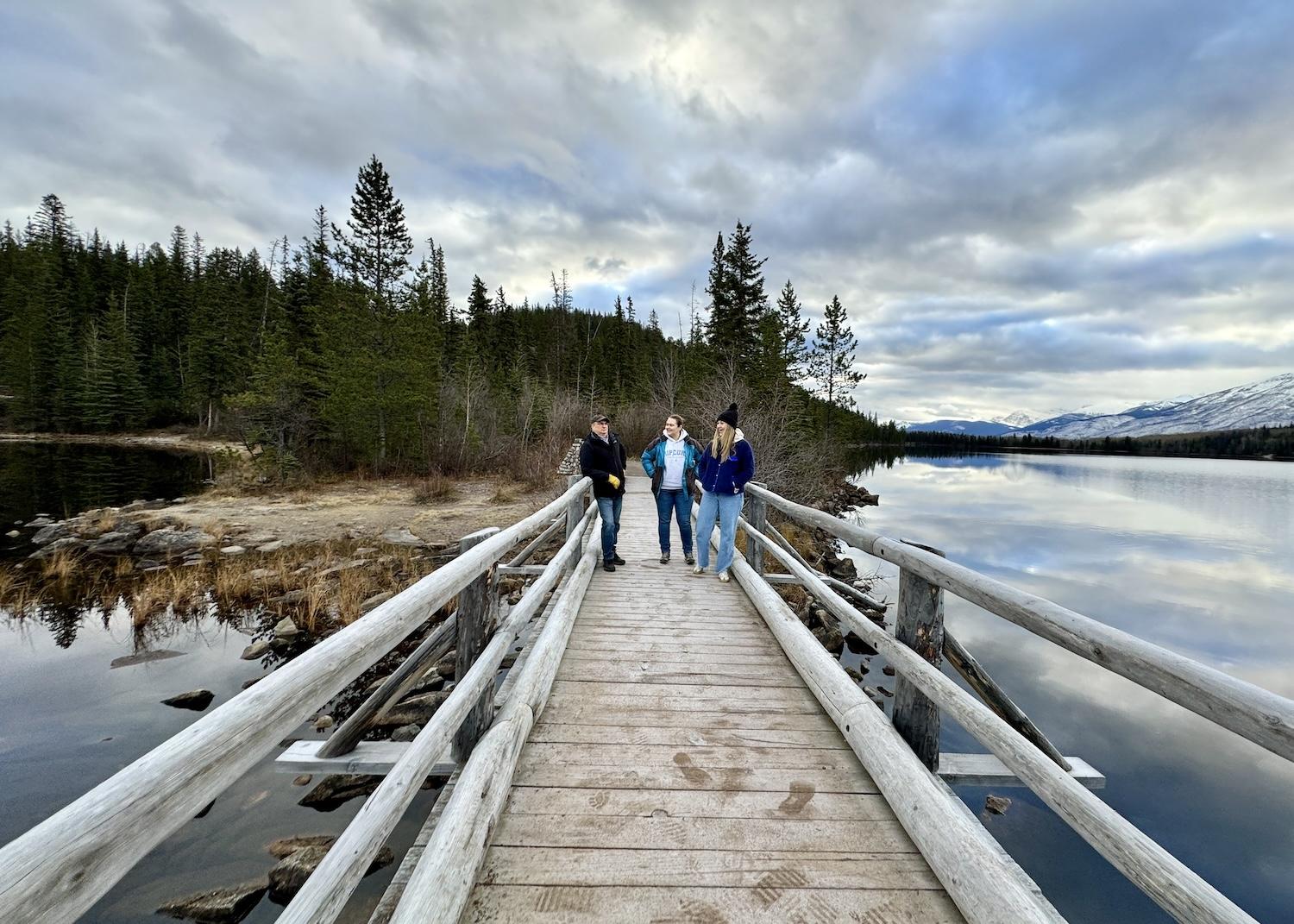 SunDog Tours guide Kevin Lazzari takes Australian tourists Jill and Keryn McAullay over the footbridge to Pyramid Island.
