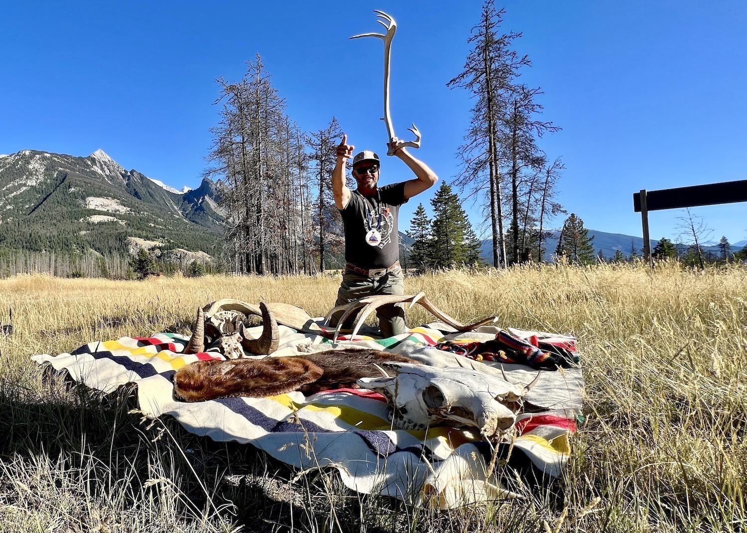Joe Urie, the Métis owner of the Jasper Tour Co., shows off a caribou antler, bison skull and more in Jasper National Park.