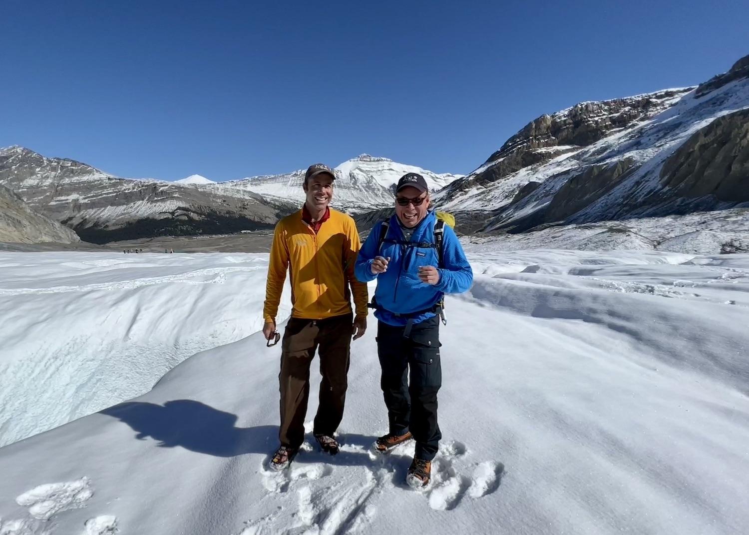 IceWalk's Corin Lohmann and Zucmin Guiding's Tim Patterson stand on the Athabasca Glacier in Jasper National Park, Alberta.