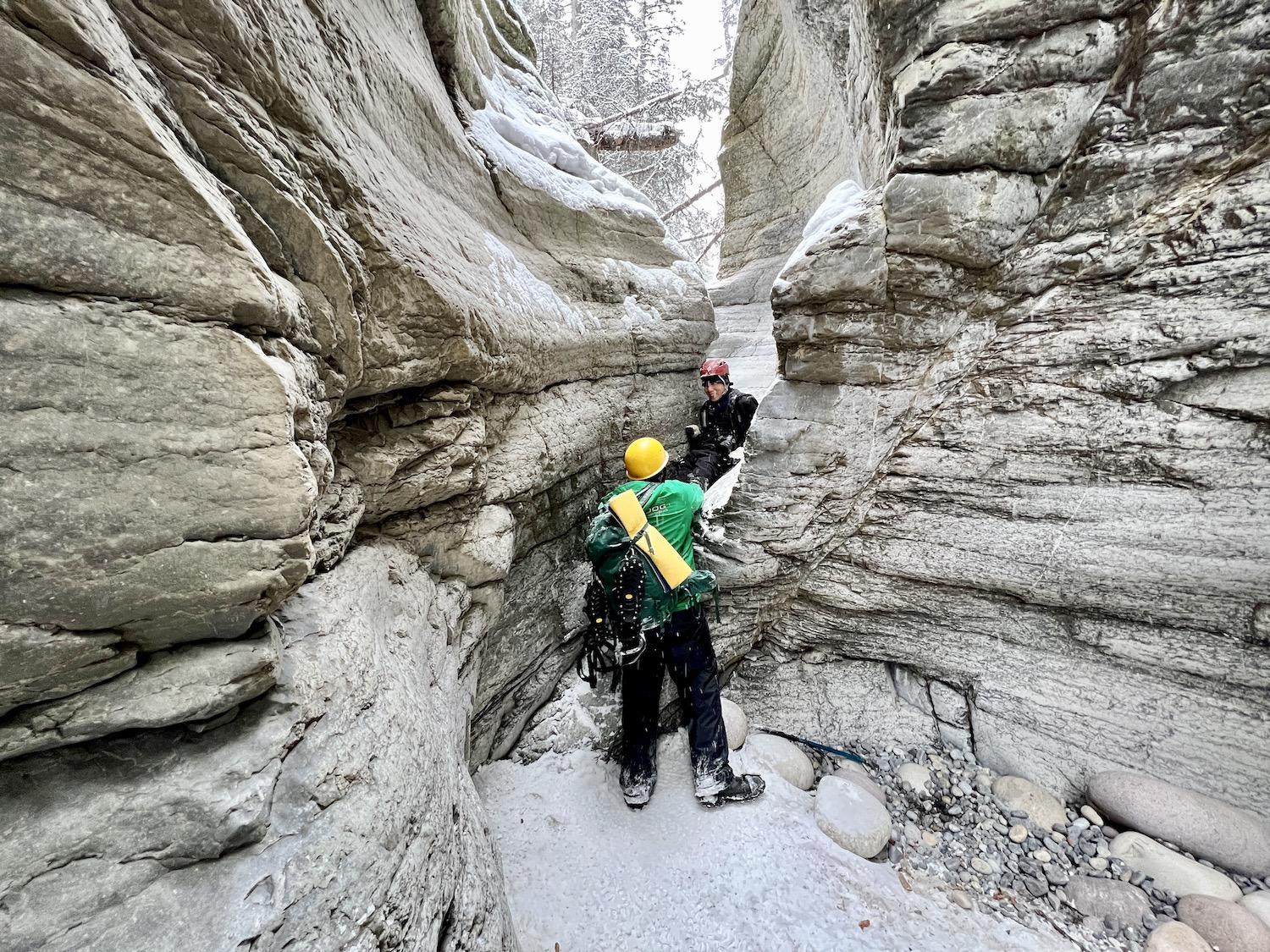 You have to sit down and slide between these rocks at one point during the Maligne Canyon icewalk.