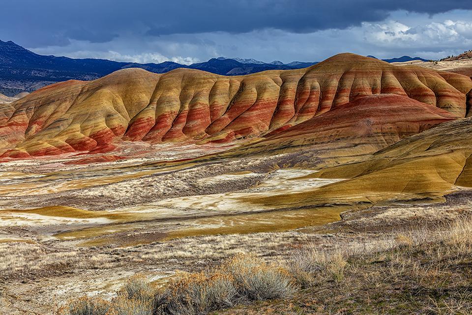Late afternoon sunlight over the Painted Hills Unit, John Day Fossil Beds National Monument / Rebecca Latson