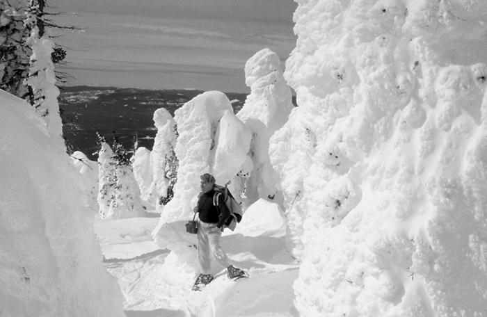 Photographer in the snow on Big Mountain / John Latson