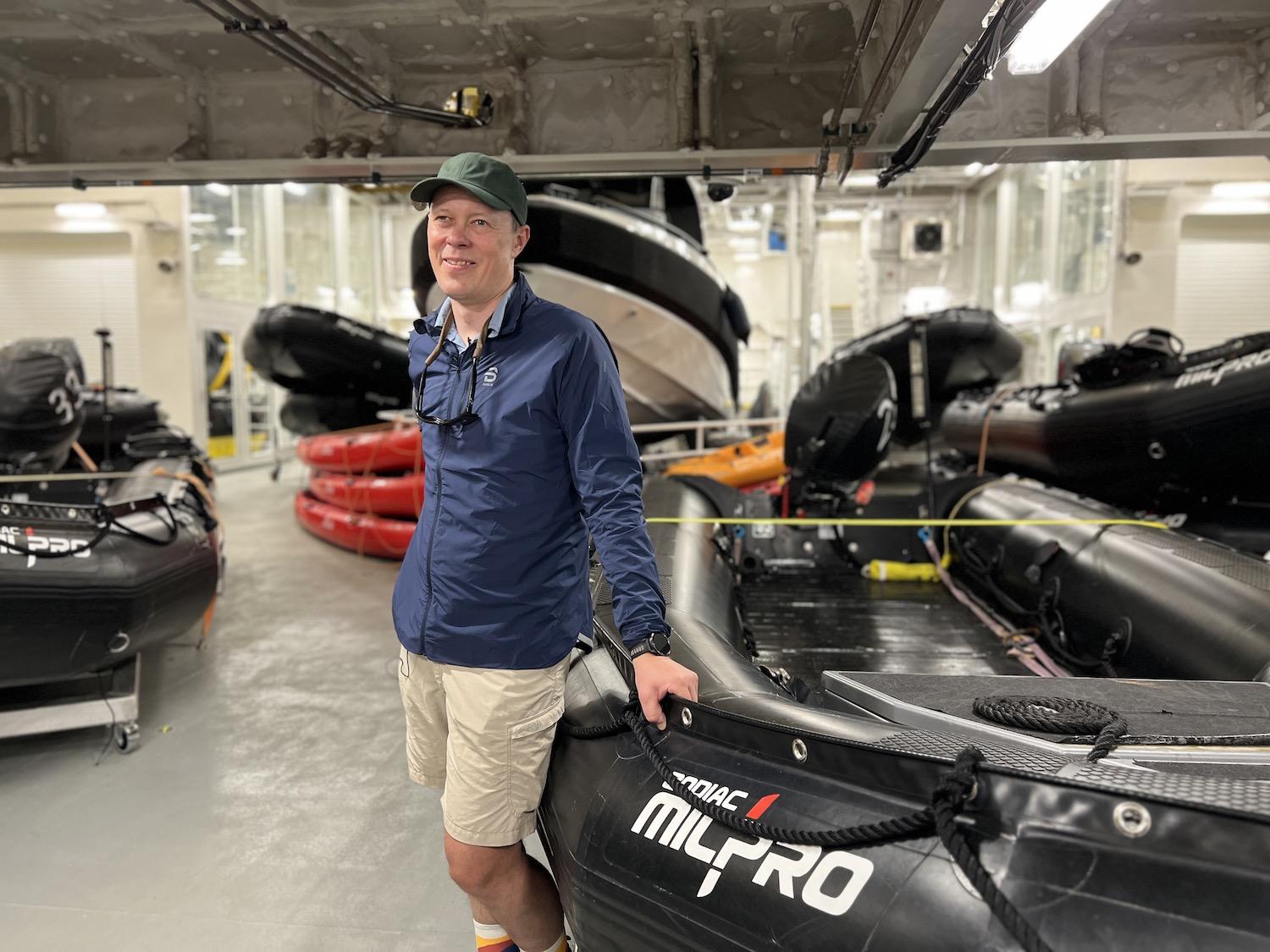 Jørn Henriksen, Viking's director of expedition operations, shows off the "toys" (kayaks, Zodiacs and Special Operations Boats) in the Hangar.