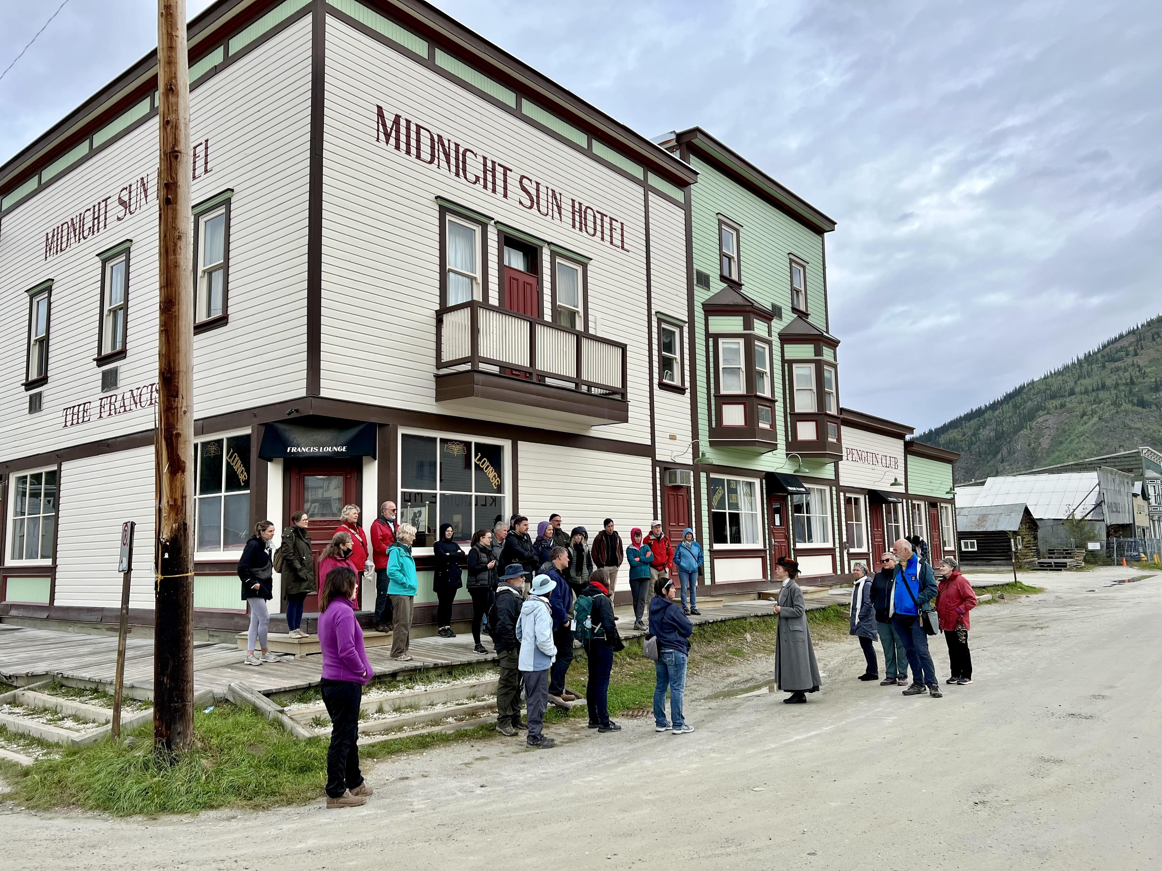 In 2022, Parks Canada heritage interpreter Miriam Behman leads a tour through buildings that form the Dawson Historical Complex National Historic Site.