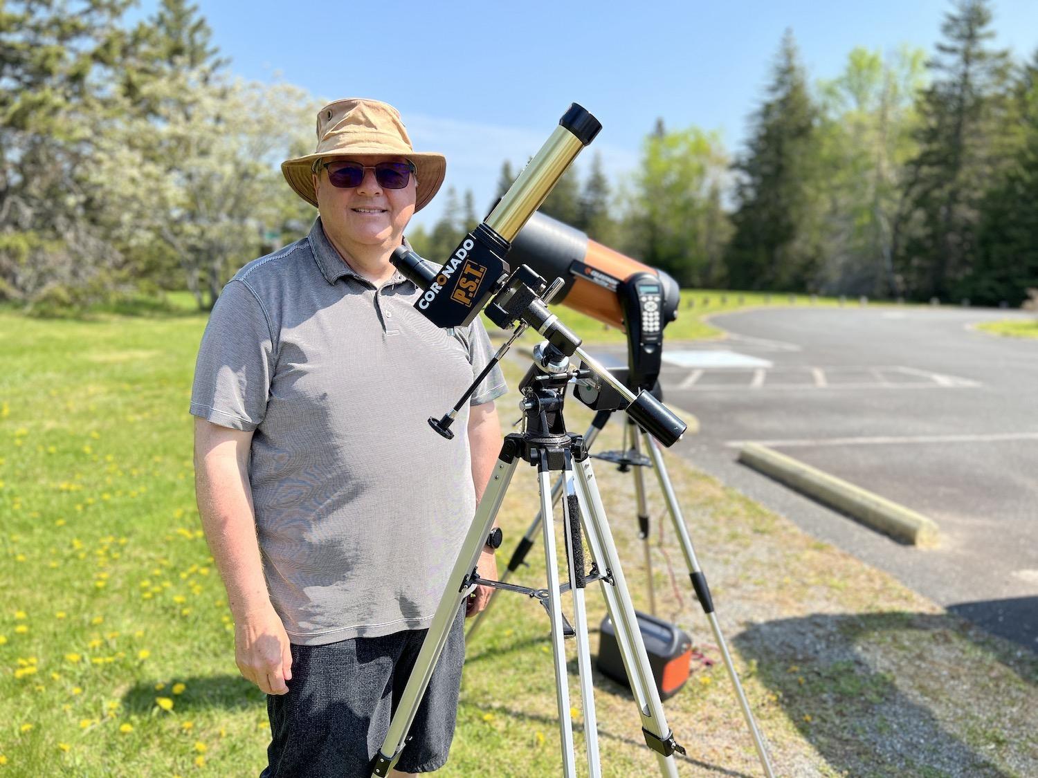 Yvon Hachey, a volunteer member of RASC, brings his telescope to Kouchibouguac National Park.