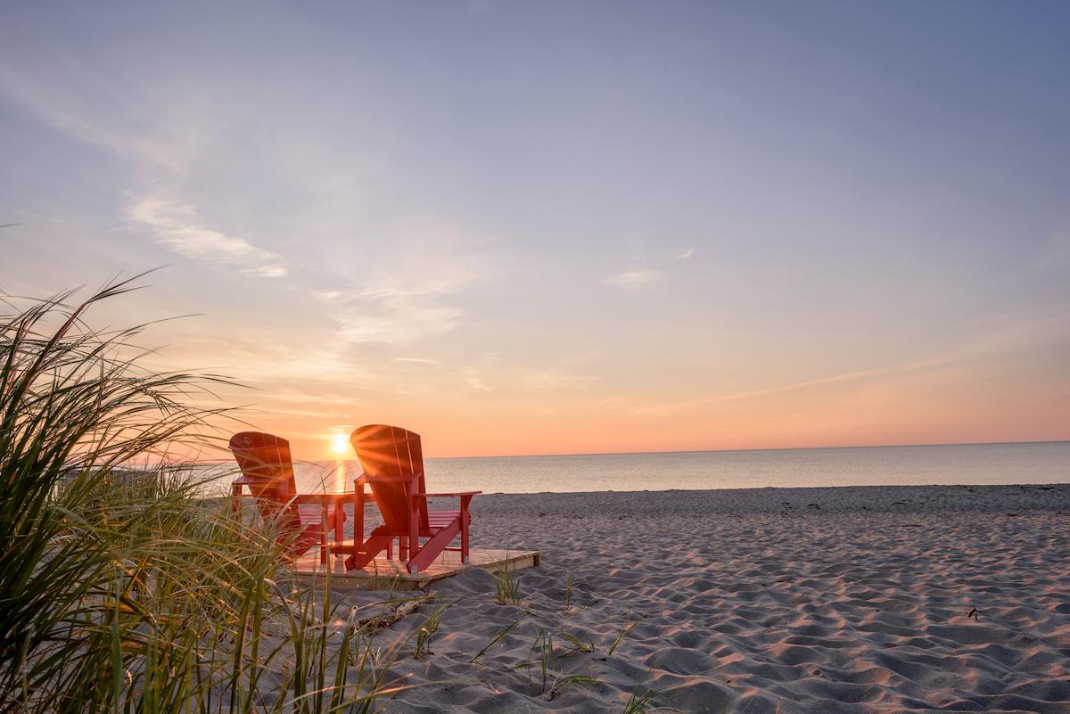 Enjoy the sunset at Kouchibouguac National Park, but keep your distance from others.